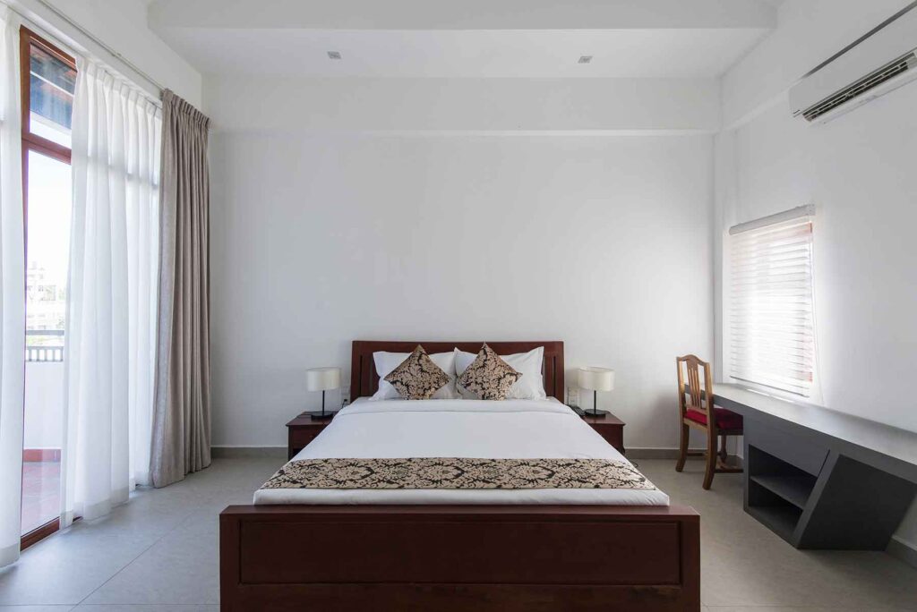 A calm bedroom offers a nice spot to unwind after work, showing McCandless Plumbing & Excavation cares about comfort.