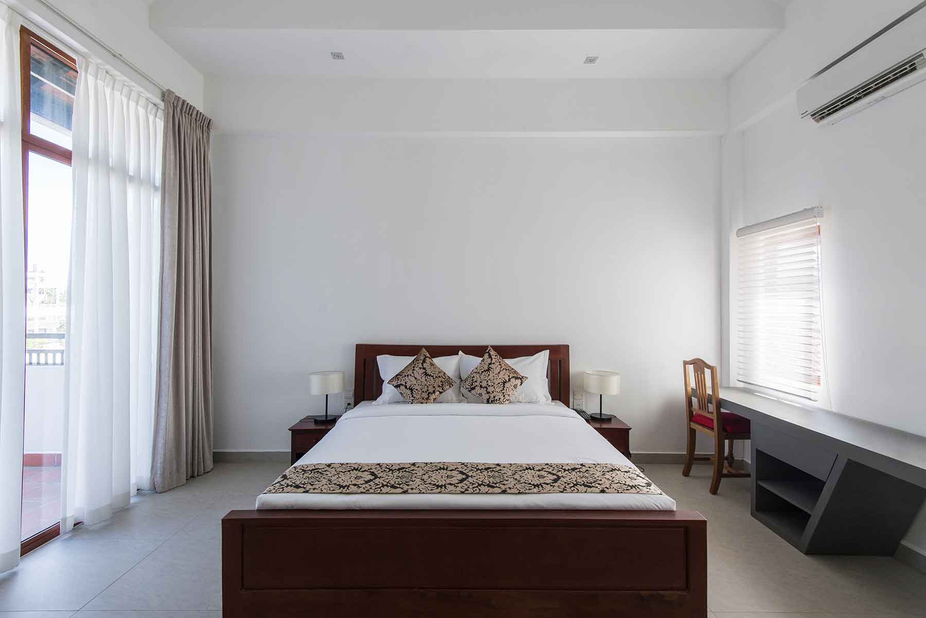 A calm bedroom offers a nice spot to unwind after work, showing McCandless Plumbing & Excavation cares about comfort.