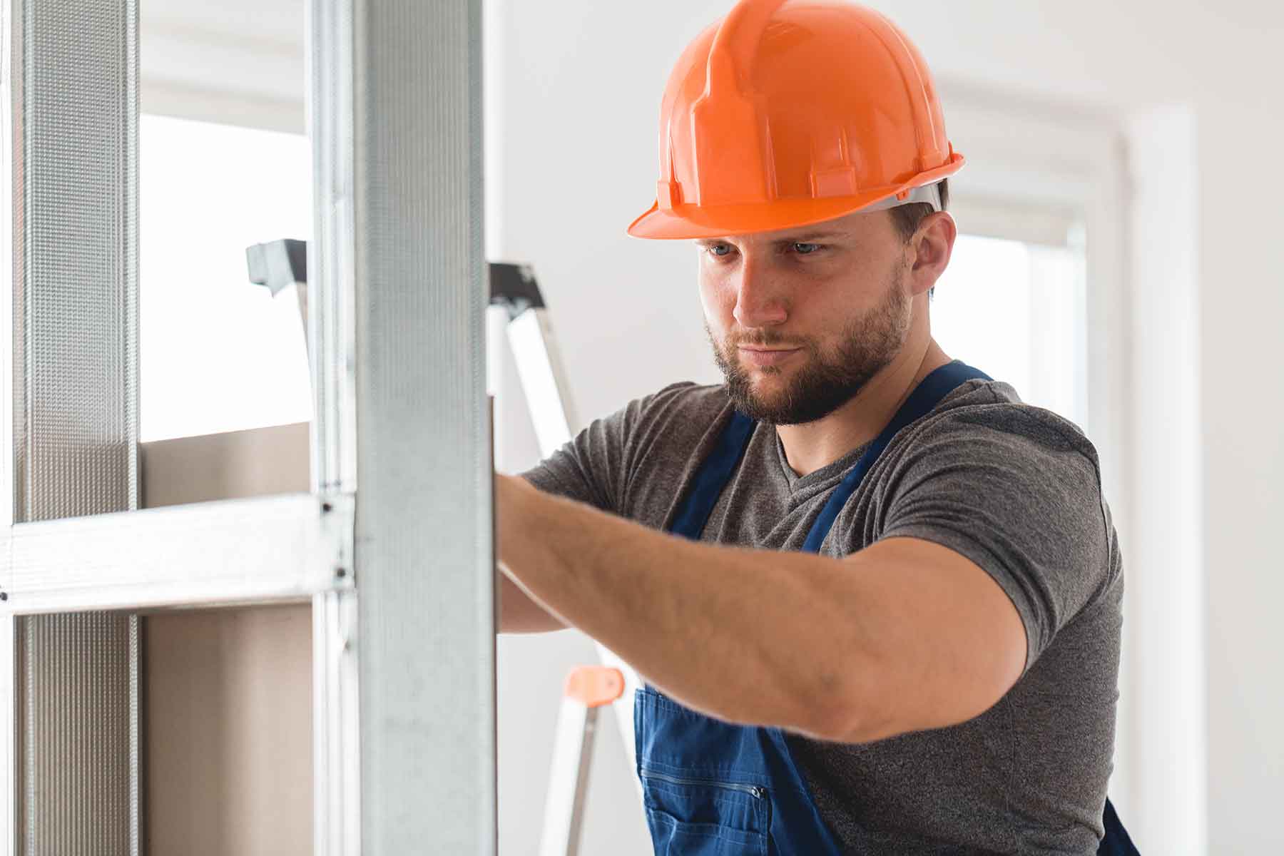 A worker shows McCandless Plumbing & Excavation’s careful attention during an indoor inspection, focused and precise.