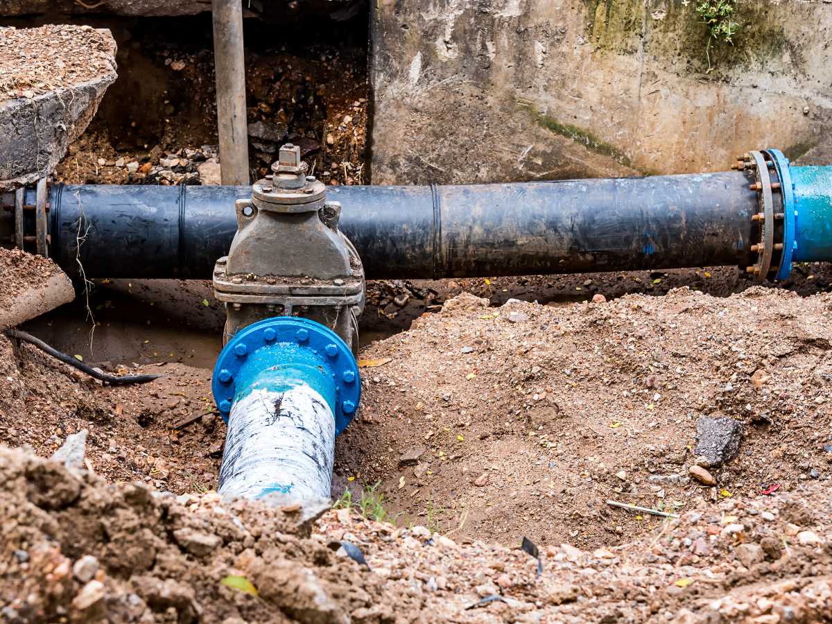 McCandless Plumbing & Excavation works on exposed underground pipes, showing skilled service for plumbing repairs and excavation.