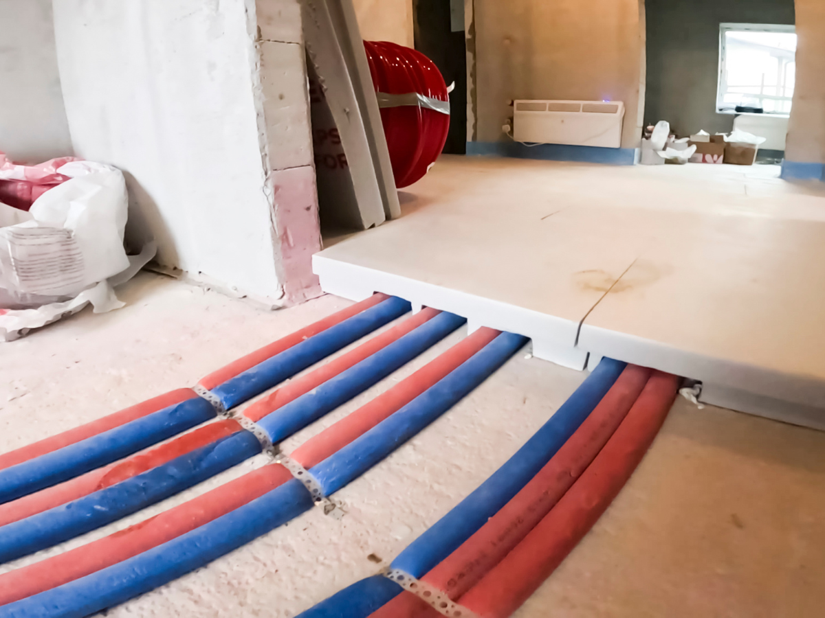 McCandless Plumbing & Excavation shows neat pipework in a building being upgraded after excavation for plumbing installation.