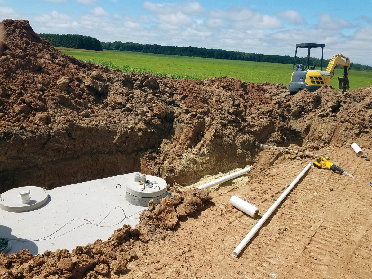 McCandless Plumbing & Excavation works on a new septic system install, preparing the site for inspection.