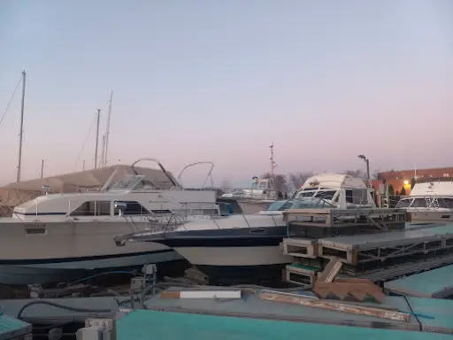 A calm marina at dusk suggests McCandless Plumbing & Excavation can help with local septic or sewer camera inspections.