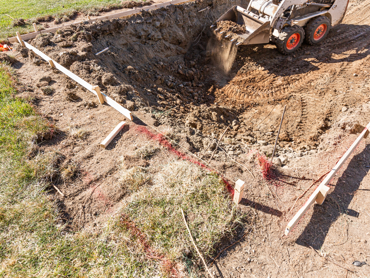 McCandless Plumbing & Excavation prepares a site for sewer work, showing readiness and expertise for repair or inspection jobs.