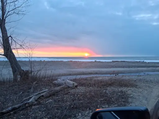 A peaceful evening drive to a septic inspection with McCandless Plumbing & Excavation, sky glowing orange and blue.