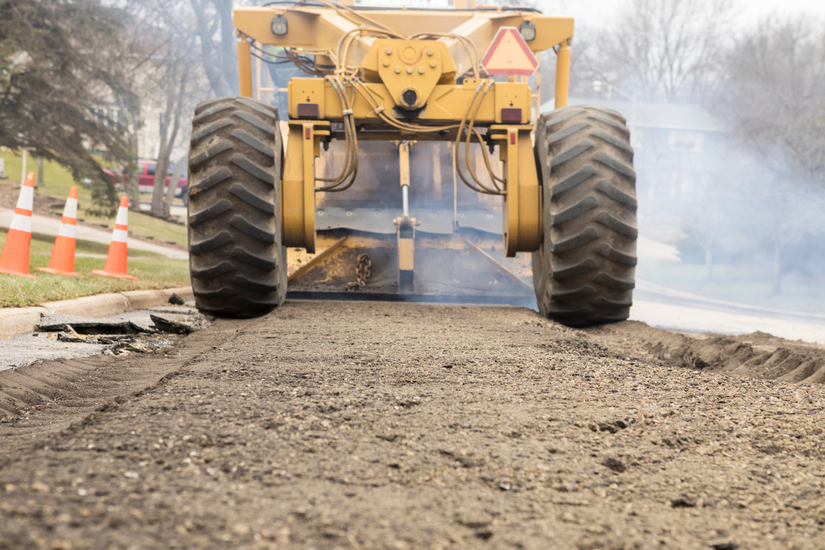 McCandless Plumbing & Excavation prepares a road for sewer repairs, showing readiness and skill for safe, reliable service.