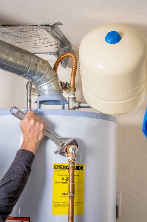 McCandless Plumbing & Excavation shows proper water heater care, important for homes needing sewer repair or updates.
