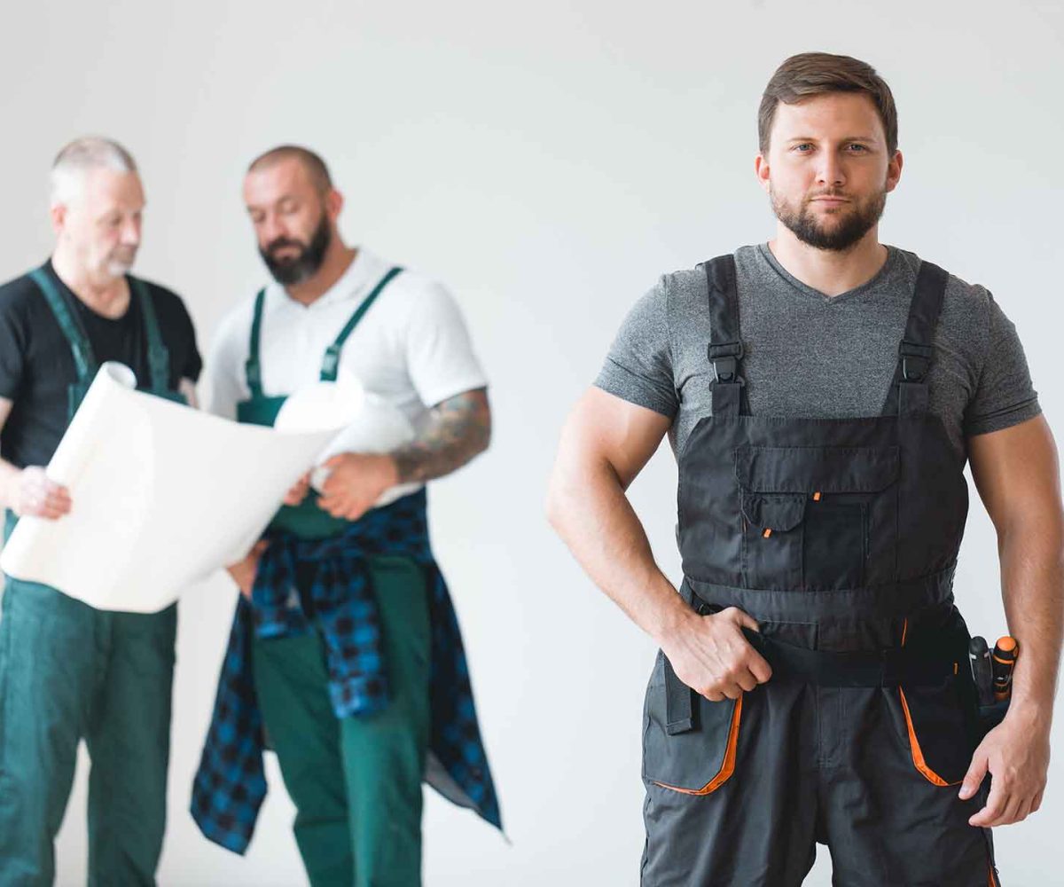 McCandless Plumbing & Excavation workers review project plans, ready to start a new plumbing or excavation job together.